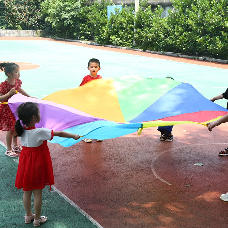 Giochi per bambini all'aperto i bambini giocano con il giocattolo del paracadute arcobaleno 2M 3M 5M attività di lavoro di squadra cooperativo bomboniere divertenti di carnevale per feste
